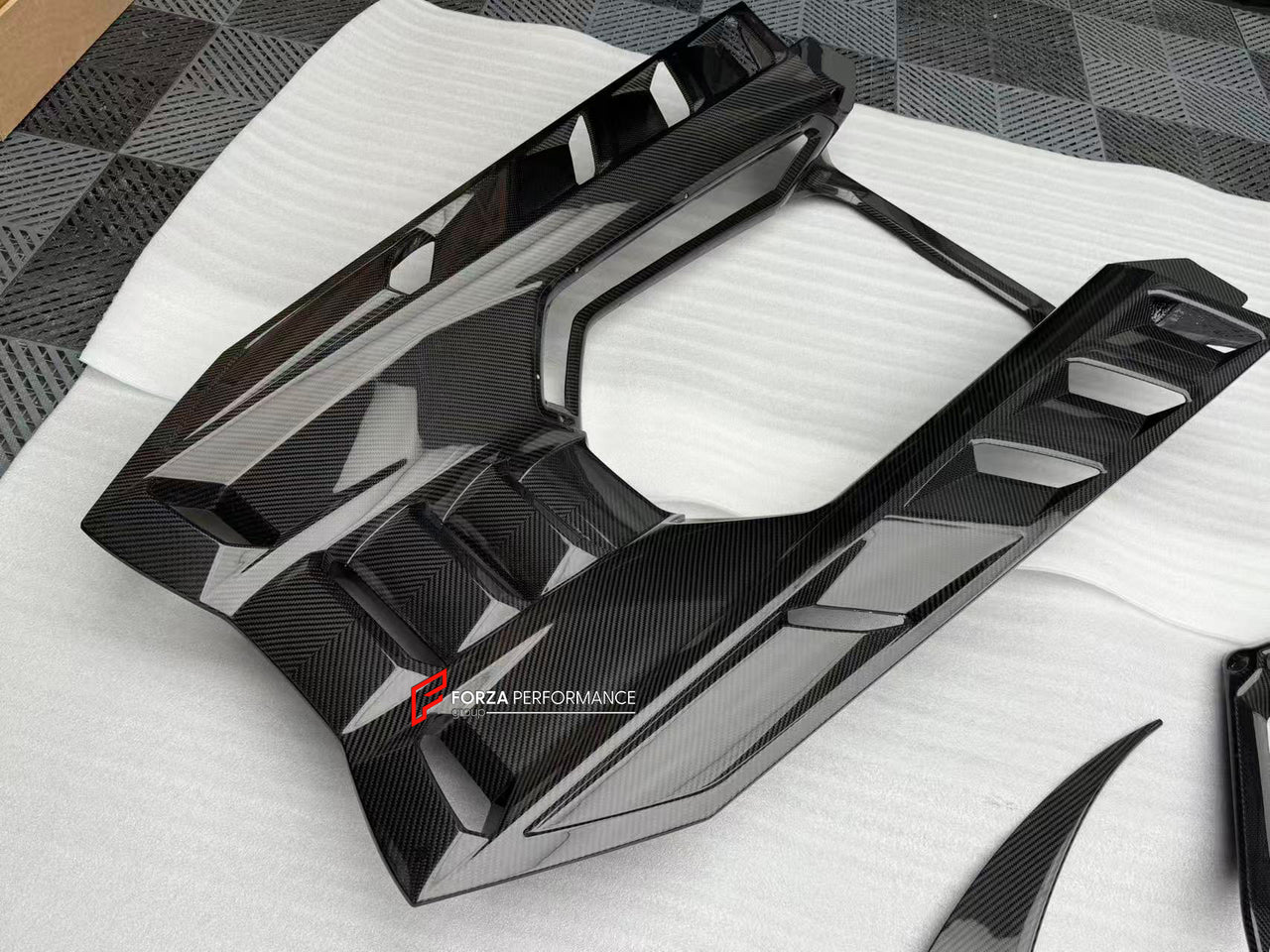 CARBON FRONT LIP for LAMBORGHINI REVUELTO 2023+

Set includes:

Front Lip Splitter
Front Bumper Canards
Side Mirror Covers
Fender Trims
Side Skirts
Air Vents Trims
Rear Engine Bay Cover
Rear Wing Spoiler
Rear Bumper Canards
Rear Diffuser

Material: Carbon

NOTE: Professional installation is required.