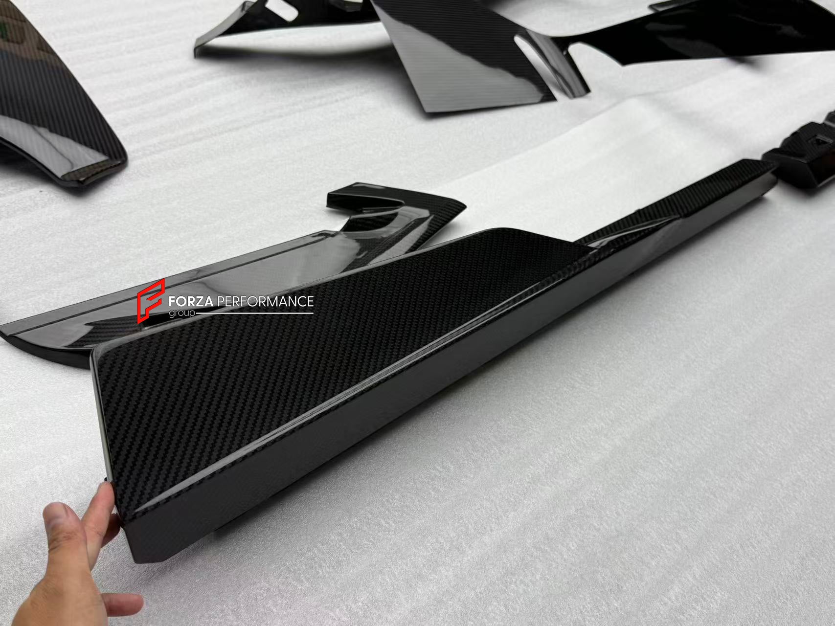 CARBON FRONT LIP for LAMBORGHINI REVUELTO 2023+

Set includes:

Front Lip Splitter
Front Bumper Canards
Side Mirror Covers
Fender Trims
Side Skirts
Air Vents Trims
Rear Engine Bay Cover
Rear Wing Spoiler
Rear Bumper Canards
Rear Diffuser

Material: Carbon

NOTE: Professional installation is required.