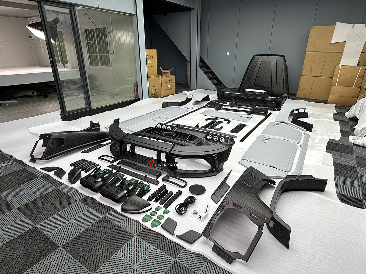 CARBON WIDE BODY KIT for MERCEDES-BENZ G-CLASS G63 W465 2024+


Set includes:

Front Lip
Front Bumper Assembly

Grille Frame
Grille
Headlight Cover
Front Fenders
Front Fender Flares
Hood / Bonnet
Hood / Bonnet Air Vent Cover
Roof LED DRL Bar

Roof Trims
Rear Spoiler
Door Panels
Rear Fenders
Rear Fender Flares
D Pillar Add-Ons
Spare Tire Cover
Rear Trunk Cover
Rear Bumper
Rear Diffuser

Material: Carbon Fiber