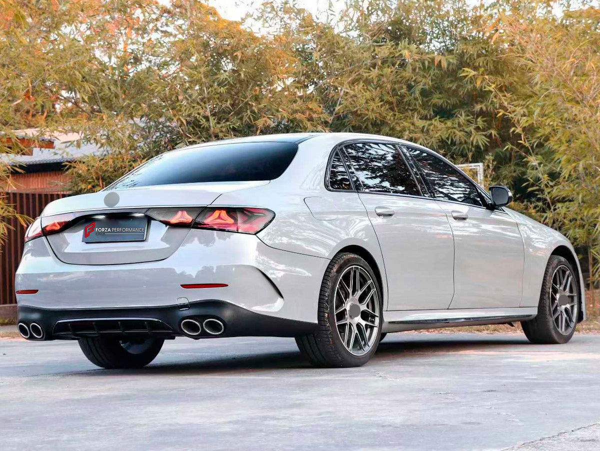 CONVERSION UPGRADE FACELIFT OLD TO NEW BODY KIT for Mercedes Benz E CLASS W213 2017 - 2024 to W214 E53 AMG 2024+
Set includes:

Front Lip
Front Bumper Assembly
Front Grille
Hood Bonnet
Front Fenders
Side Skirts
Trunk Lid
Rear Bumper Assembly
Rear Diffuser
Exhaust Tips
Material: Plastic

NOTE: Professional installation is required.