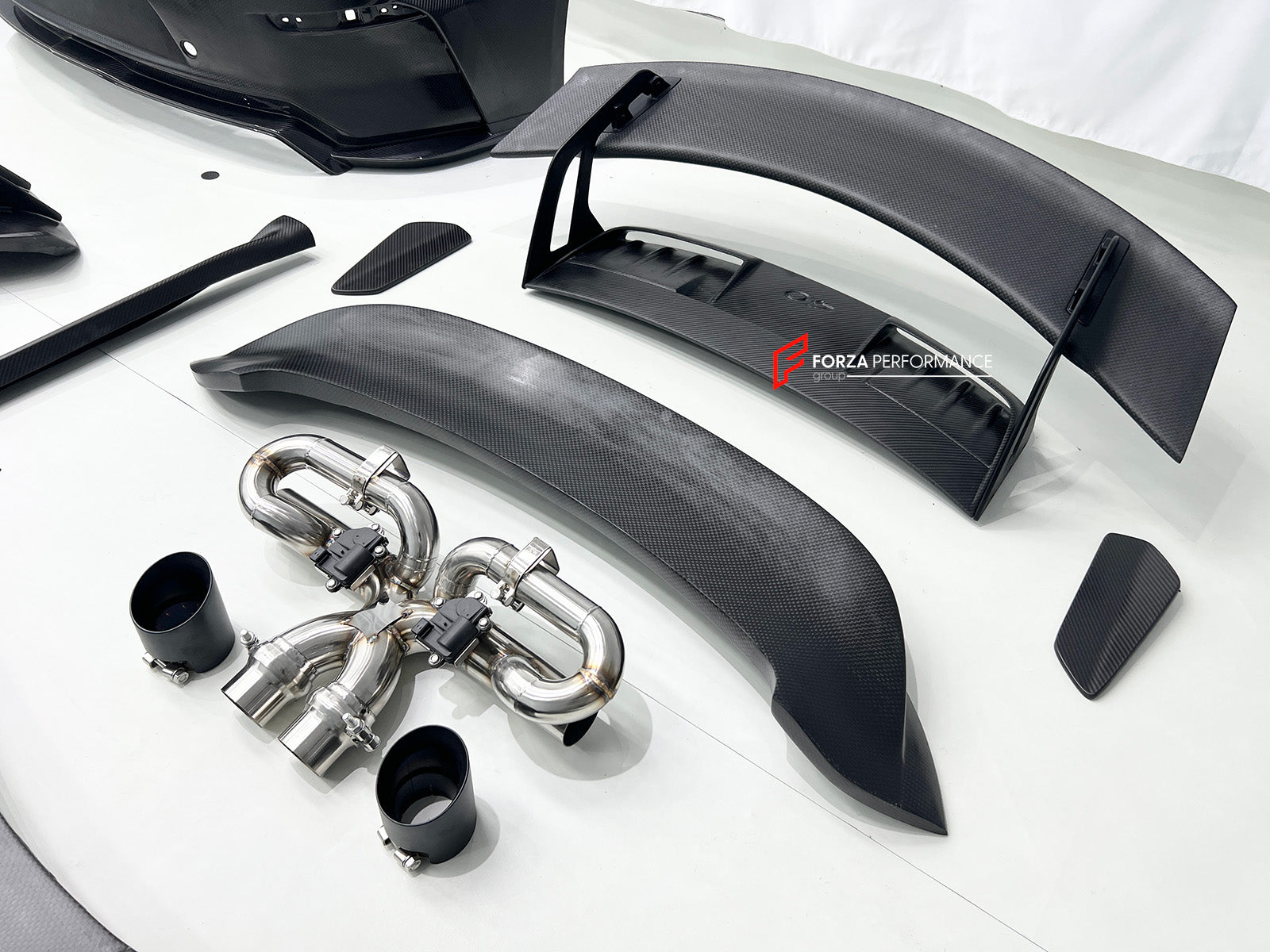 CONVERSION BODY KIT for PORSCHE 911 992.1 CARRERA 2019 - 2023 to 992.2 GT3

Set includes:
Front Bumper Assembly
Hood / Bonnet
Side Skirts
Rear Spoiler
Rear Bumper
Rear Diffuser
Muffler With Valves
Exhaust Tips

Material: Dry Carbon

NOTE: Professional installation is required