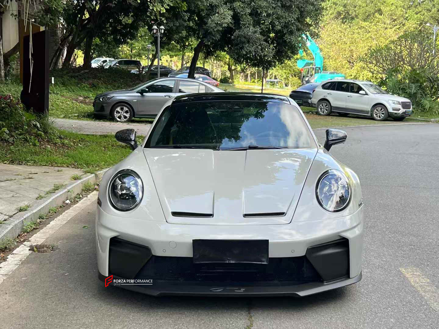 CONVERSION BODY KIT for PORSCHE 911 992.1 CARRERA 2019 - 2023 to 992.2 GT3

Set includes:
Front Bumper Assembly
Hood / Bonnet
Side Skirts
Rear Spoiler
Rear Bumper
Rear Diffuser
Muffler With Valves
Exhaust Tips

Material: Dry Carbon

NOTE: Professional installation is required