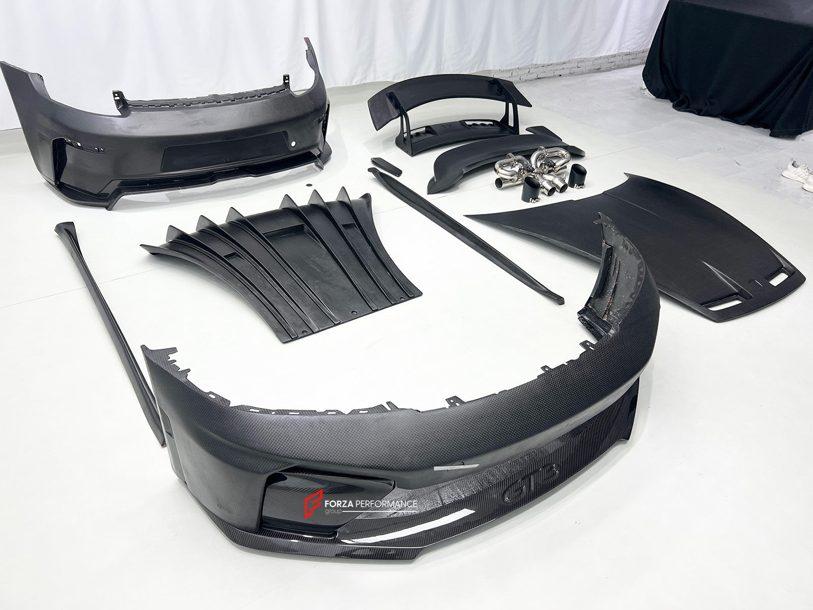 CONVERSION BODY KIT for PORSCHE 911 992.1 CARRERA 2019 - 2023 to 992.2 GT3

Set includes:
Front Bumper Assembly
Hood / Bonnet
Side Skirts
Rear Spoiler
Rear Bumper
Rear Diffuser
Muffler With Valves
Exhaust Tips

Material: Dry Carbon

NOTE: Professional installation is required