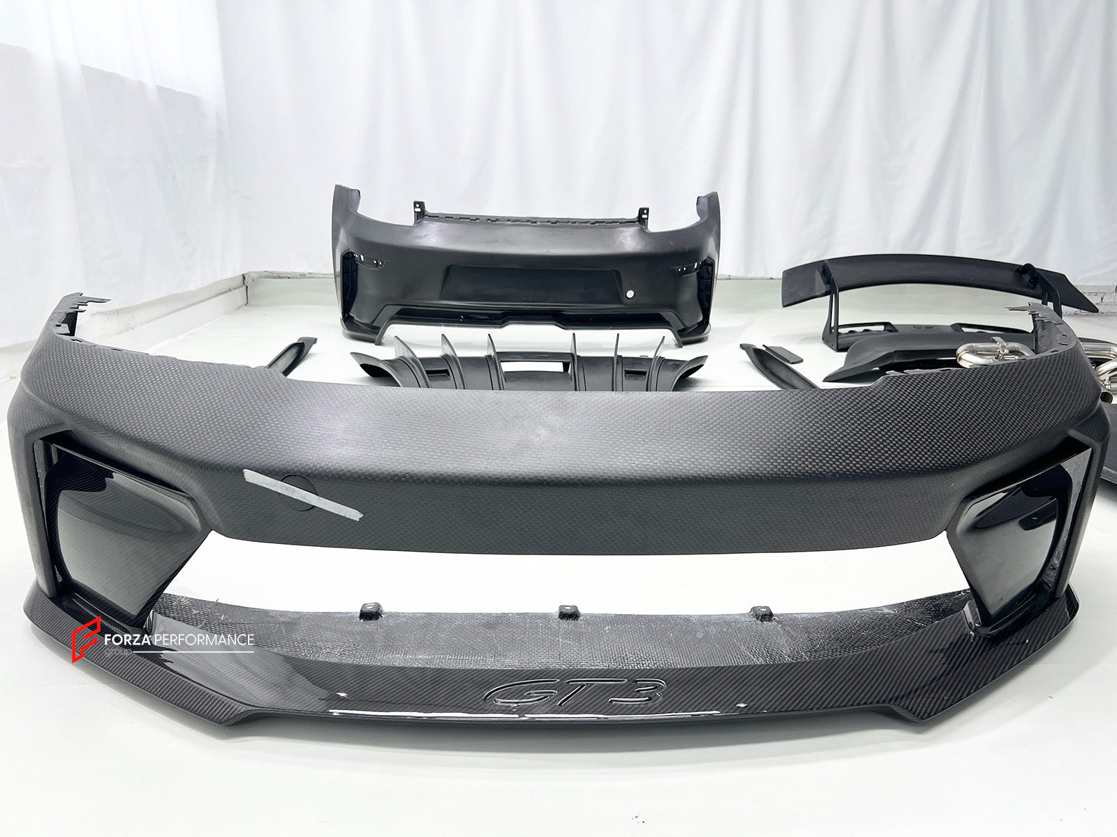 CONVERSION BODY KIT for PORSCHE 911 992.1 CARRERA 2019 - 2023 to 992.2 GT3

Set includes:
Front Bumper Assembly
Hood / Bonnet
Side Skirts
Rear Spoiler
Rear Bumper
Rear Diffuser
Muffler With Valves
Exhaust Tips

Material: Dry Carbon

NOTE: Professional installation is required