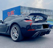 CONVERSION 718 982 GT4 BODY KIT for PORSCHE CAYMAN 987 2005 - 2013
Set includes:

Front Lip
Front Bumper Air Vent Trims
Front Bumper Fins
Front Grille
Led Light Covers / Front Fascia Attachments
License Plate
Rear Bumper Assembly (FRP)
Rear Diffuser (FRP)
Material: Plastic + FRP

NOTE: Professional installation is required.