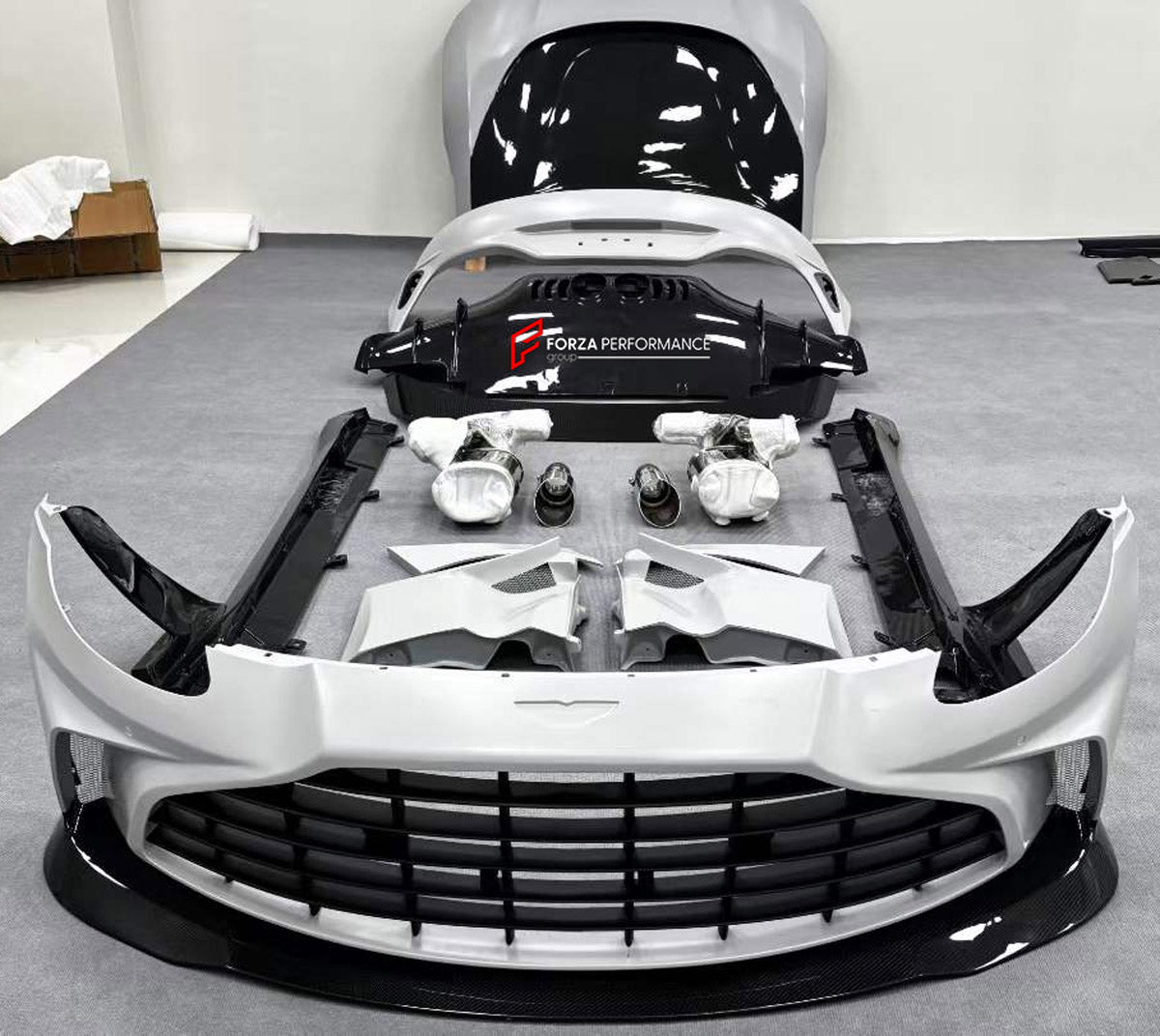 CONVERSION DRY CARBON BODY KIT for ASTON MARTIN VANTAGE AM6 2018 - 2024 UPGRADE to V12 VANTAGE AM6 2022+ FORZA PERFORMANCE custom fit V12 Vantage Style

Set includes:
Front Lip
Front Bumper Assembly
Hood Bonnet
Front Fender Air Vents
Side Skirts
Rear Bumper Assembly
Rear Diffuser
Exhaust Tips

Material: Dry Carbon

NOTE: Professional installation is required.
