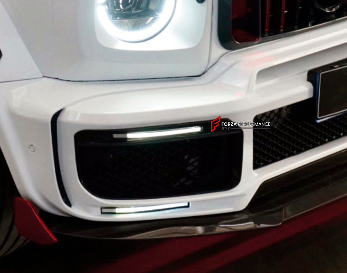 CONVERSION DRY CARBON FOG LIGHT COVERS for MERCEDES-BENZ G-CLASS W463 2008 - 2018 UPGRADE to G-CLASS W464 2019 - 2024

Set includes:
Front Bumper Fog Light Covers

Material: Dry Carbon

NOTE: Professional installation is required.