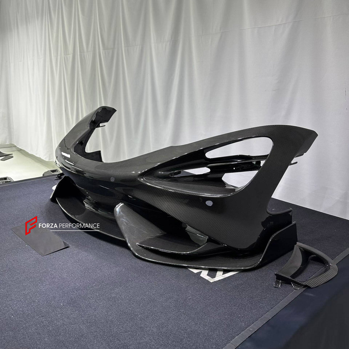 CONVERSION DRY CARBON FRONT BUMPER ASSEMBLY for MCLAREN 720S COUPE 2017 - 2023 UPGRADE to 765LT 2020 - 2023

Set includes:
Front Bumper Assembly

Material: Dry Carbon

NOTE: Professional installation is required.