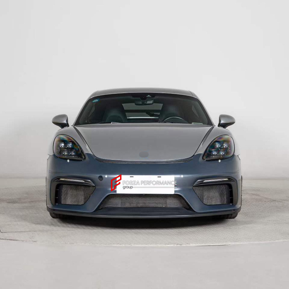 CONVERSION FRONT BUMPER ASSEMBLY for PORSCHE 718 982 CAYMAN BOXSTER 2016 - 2025 UPGRADE to 718 GT4 2019 - 2023 FORZA PERFORMANCE custom fit GT4 Style

Set includes:
Front Bumper Assembly

Material: Plastic

NOTE: Professional installation is required.