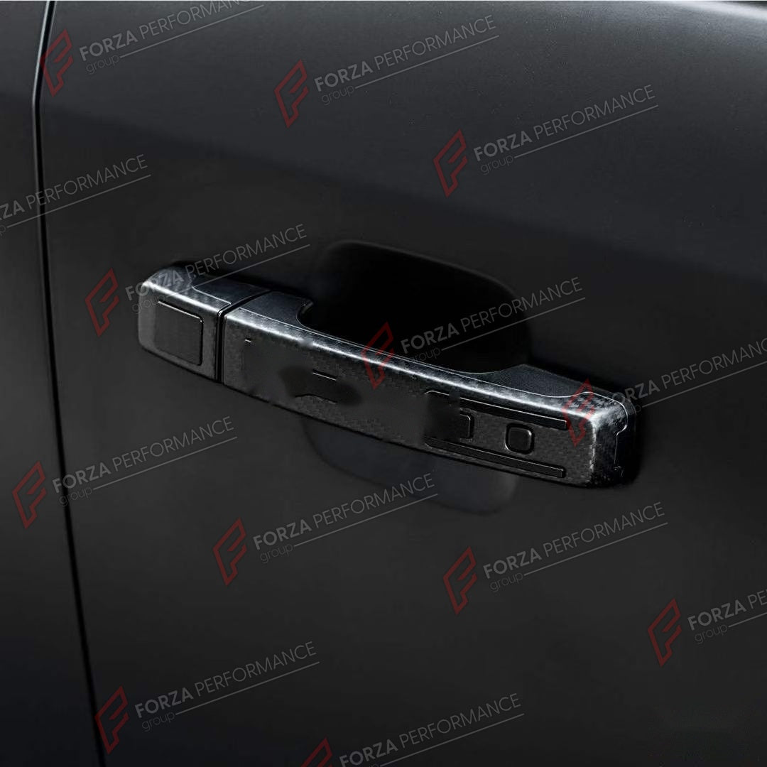 DOOR HANDLE COVER for LAND ROVER DEFENDER 90 110 130 L663 2020+

Set includes:
Door Handle Covers
Tailgate Handle Cover

Material: ABS with Carbon Fiber Finish

NOTE: Professional installation is required.