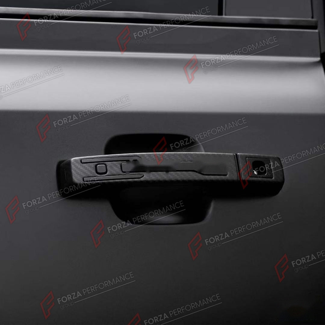 DOOR HANDLE COVER for LAND ROVER DEFENDER 90 110 130 L663 2020+

Set includes:
Door Handle Covers
Tailgate Handle Cover

Material: ABS with Carbon Fiber Finish

NOTE: Professional installation is required.