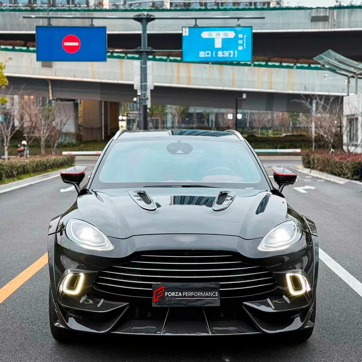 DRY CARBON BODY KIT for Aston Martin DBX AM8 2020 - 2024
Set includes:

Front Lip
Front Canards
Hood Air Vents
Side Mirrors
Side Fenders
Side Air Vents
Side Skirts
Rear Bumper
Rear Spoiler Wing
Exhaust System
Exhaust Tips
Material: Dry Carbon

NOTE: Professional installation is required.