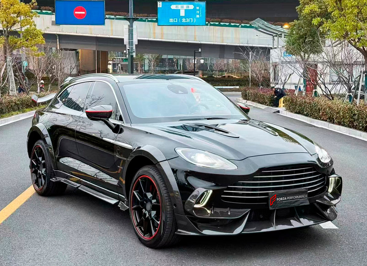 DRY CARBON BODY KIT for Aston Martin DBX AM8 2020 - 2024
Set includes:

Front Lip
Front Canards
Hood Air Vents
Side Mirrors
Side Fenders
Side Air Vents
Side Skirts
Rear Bumper
Rear Spoiler Wing
Exhaust System
Exhaust Tips
Material: Dry Carbon

NOTE: Professional installation is required.