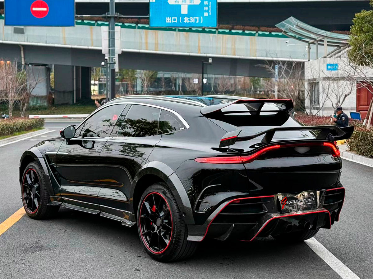 DRY CARBON BODY KIT for Aston Martin DBX AM8 2020 - 2024
Set includes:

Front Lip
Front Canards
Hood Air Vents
Side Mirrors
Side Fenders
Side Air Vents
Side Skirts
Rear Bumper
Rear Spoiler Wing
Exhaust System
Exhaust Tips
Material: Dry Carbon

NOTE: Professional installation is required.