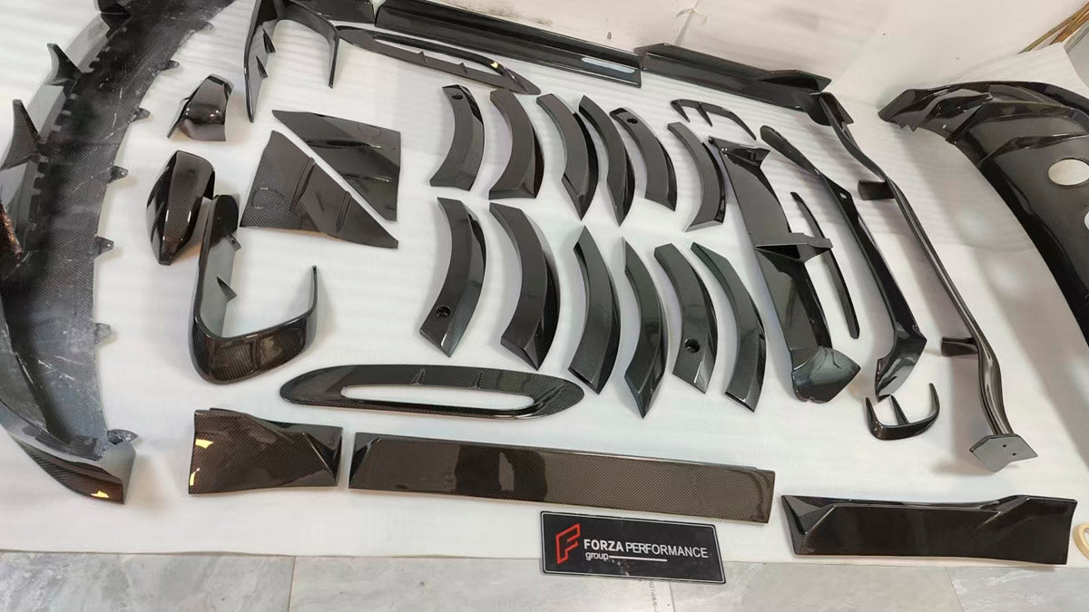 DRY CARBON BODY KIT for Aston Martin DBX AM8 2020 - 2024
Set includes:

Front Lip
Front Canards
Hood Air Vents
Side Mirrors
Side Fenders
Side Air Vents
Side Skirts
Rear Bumper
Rear Spoiler Wing
Exhaust System
Exhaust Tips
Material: Dry Carbon

NOTE: Professional installation is required.