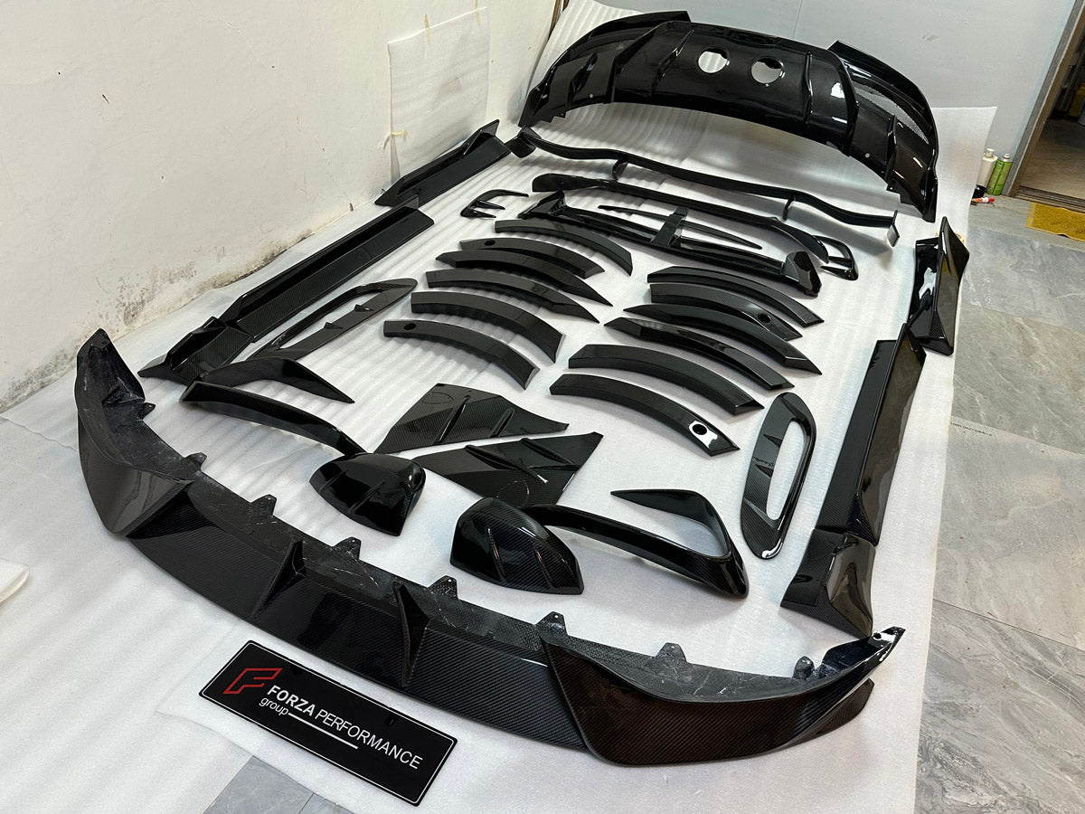 DRY CARBON BODY KIT for Aston Martin DBX AM8 2020 - 2024
Set includes:

Front Lip
Front Canards
Hood Air Vents
Side Mirrors
Side Fenders
Side Air Vents
Side Skirts
Rear Bumper
Rear Spoiler Wing
Exhaust System
Exhaust Tips
Material: Dry Carbon

NOTE: Professional installation is required.