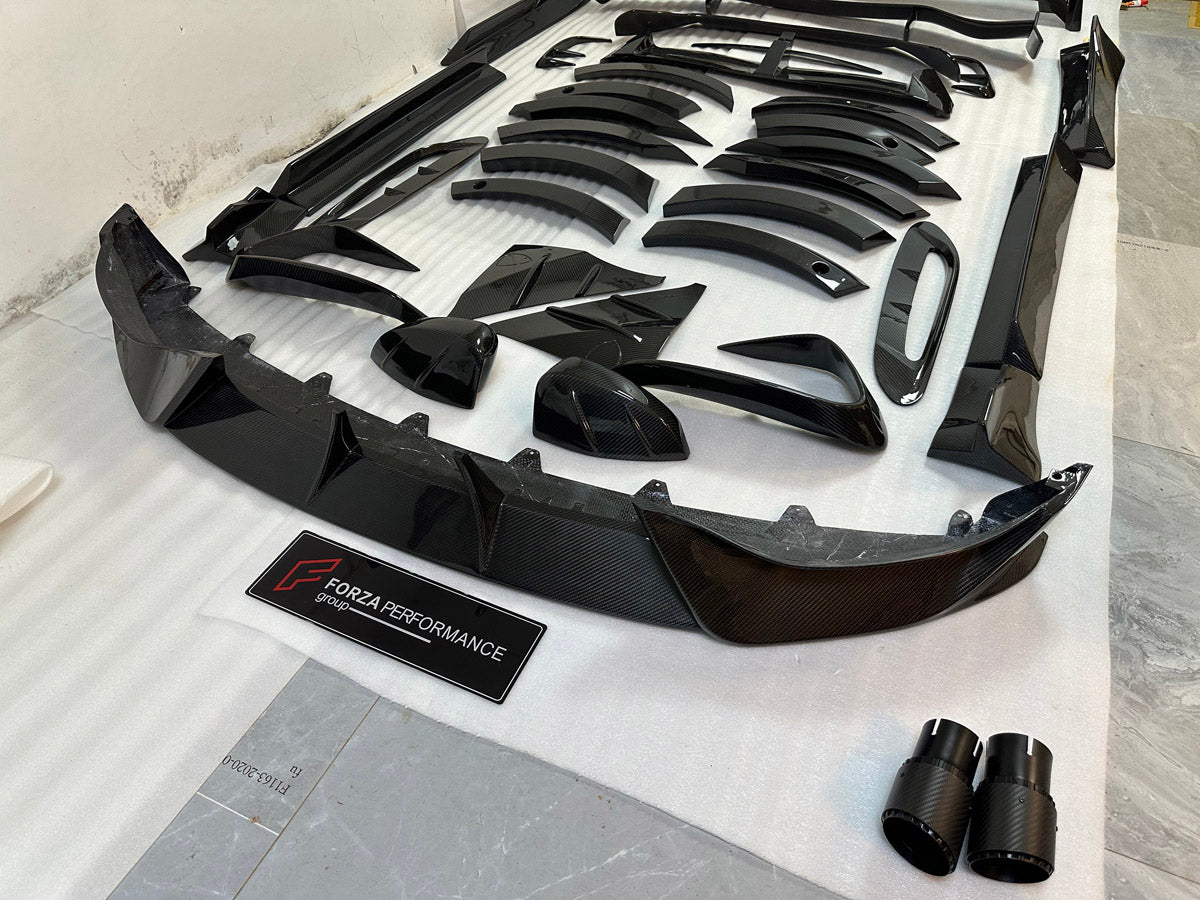 DRY CARBON BODY KIT for Aston Martin DBX AM8 2020 - 2024
Set includes:

Front Lip
Front Canards
Hood Air Vents
Side Mirrors
Side Fenders
Side Air Vents
Side Skirts
Rear Bumper
Rear Spoiler Wing
Exhaust System
Exhaust Tips
Material: Dry Carbon

NOTE: Professional installation is required.