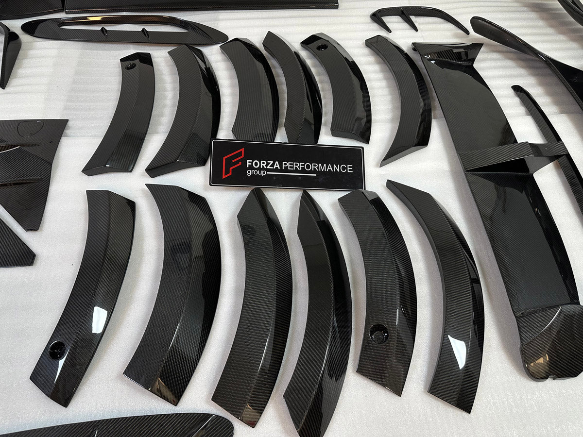 DRY CARBON BODY KIT for Aston Martin DBX AM8 2020 - 2024
Set includes:

Front Lip
Front Canards
Hood Air Vents
Side Mirrors
Side Fenders
Side Air Vents
Side Skirts
Rear Bumper
Rear Spoiler Wing
Exhaust System
Exhaust Tips
Material: Dry Carbon

NOTE: Professional installation is required.