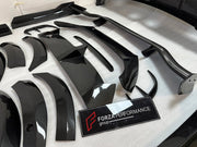 DRY CARBON BODY KIT for Aston Martin DBX AM8 2020 - 2024
Set includes:

Front Lip
Front Canards
Hood Air Vents
Side Mirrors
Side Fenders
Side Air Vents
Side Skirts
Rear Bumper
Rear Spoiler Wing
Exhaust System
Exhaust Tips
Material: Dry Carbon

NOTE: Professional installation is required.