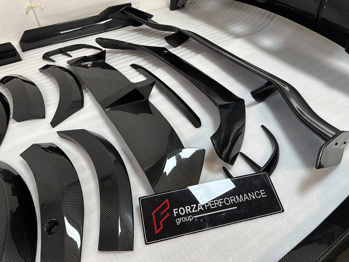 DRY CARBON BODY KIT for Aston Martin DBX AM8 2020 - 2024
Set includes:

Front Lip
Front Canards
Hood Air Vents
Side Mirrors
Side Fenders
Side Air Vents
Side Skirts
Rear Bumper
Rear Spoiler Wing
Exhaust System
Exhaust Tips
Material: Dry Carbon

NOTE: Professional installation is required.