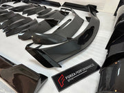 DRY CARBON BODY KIT for Aston Martin DBX AM8 2020 - 2024
Set includes:

Front Lip
Front Canards
Hood Air Vents
Side Mirrors
Side Fenders
Side Air Vents
Side Skirts
Rear Bumper
Rear Spoiler Wing
Exhaust System
Exhaust Tips
Material: Dry Carbon

NOTE: Professional installation is required.