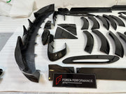 DRY CARBON BODY KIT for Aston Martin DBX AM8 2020 - 2024
Set includes:

Front Lip
Front Canards
Hood Air Vents
Side Mirrors
Side Fenders
Side Air Vents
Side Skirts
Rear Bumper
Rear Spoiler Wing
Exhaust System
Exhaust Tips
Material: Dry Carbon

NOTE: Professional installation is required.