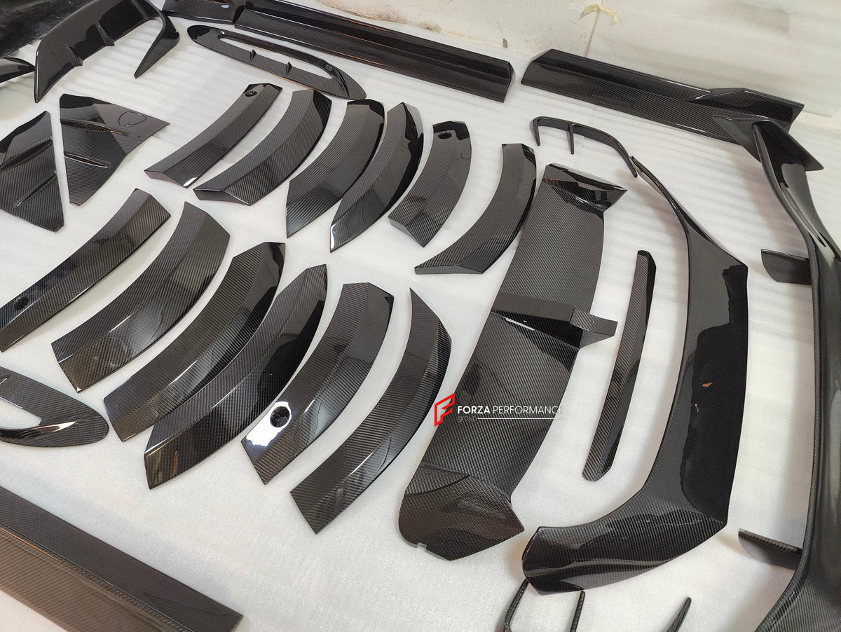 DRY CARBON BODY KIT for Aston Martin DBX AM8 2020 - 2024
Set includes:

Front Lip
Front Canards
Hood Air Vents
Side Mirrors
Side Fenders
Side Air Vents
Side Skirts
Rear Bumper
Rear Spoiler Wing
Exhaust System
Exhaust Tips
Material: Dry Carbon

NOTE: Professional installation is required.