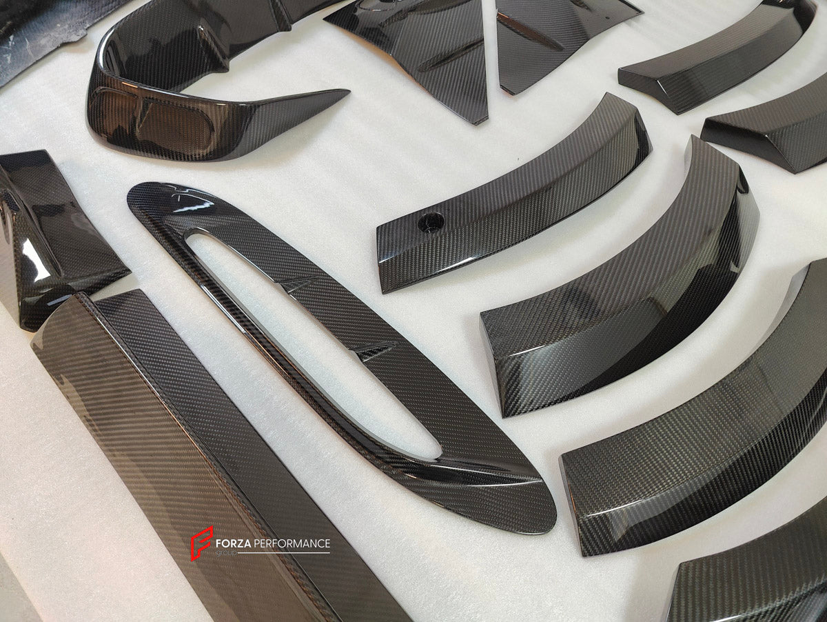 DRY CARBON BODY KIT for Aston Martin DBX AM8 2020 - 2024
Set includes:

Front Lip
Front Canards
Hood Air Vents
Side Mirrors
Side Fenders
Side Air Vents
Side Skirts
Rear Bumper
Rear Spoiler Wing
Exhaust System
Exhaust Tips
Material: Dry Carbon

NOTE: Professional installation is required.