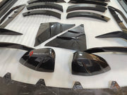DRY CARBON BODY KIT for Aston Martin DBX AM8 2020 - 2024
Set includes:

Front Lip
Front Canards
Hood Air Vents
Side Mirrors
Side Fenders
Side Air Vents
Side Skirts
Rear Bumper
Rear Spoiler Wing
Exhaust System
Exhaust Tips
Material: Dry Carbon

NOTE: Professional installation is required.