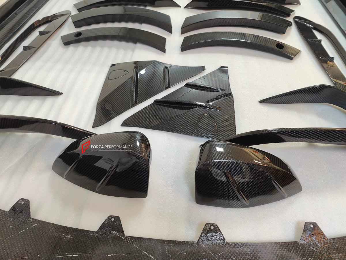 DRY CARBON BODY KIT for Aston Martin DBX AM8 2020 - 2024
Set includes:

Front Lip
Front Canards
Hood Air Vents
Side Mirrors
Side Fenders
Side Air Vents
Side Skirts
Rear Bumper
Rear Spoiler Wing
Exhaust System
Exhaust Tips
Material: Dry Carbon

NOTE: Professional installation is required.