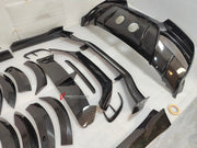 DRY CARBON BODY KIT for Aston Martin DBX AM8 2020 - 2024
Set includes:

Front Lip
Front Canards
Hood Air Vents
Side Mirrors
Side Fenders
Side Air Vents
Side Skirts
Rear Bumper
Rear Spoiler Wing
Exhaust System
Exhaust Tips
Material: Dry Carbon

NOTE: Professional installation is required.
