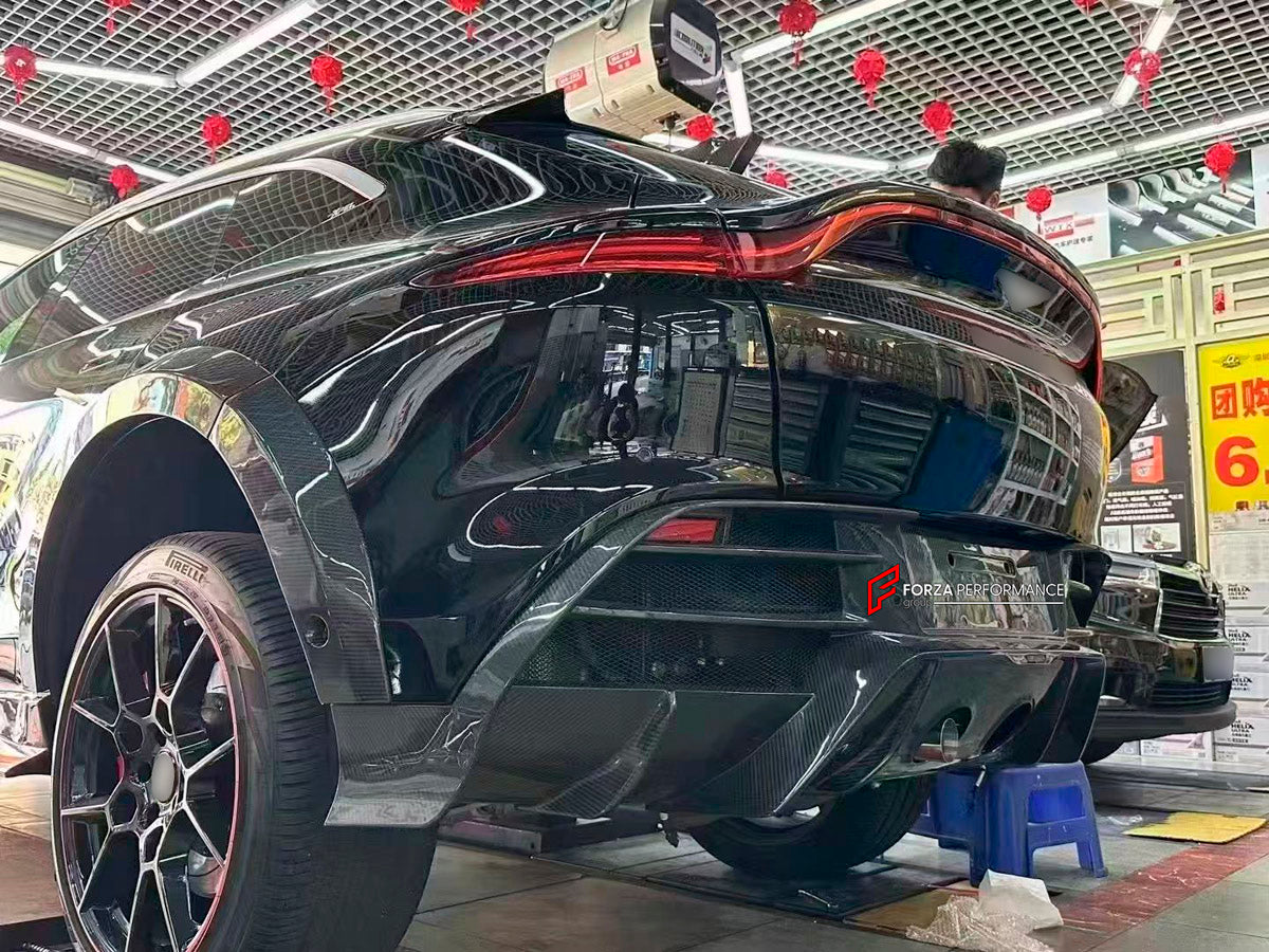 DRY CARBON BODY KIT for Aston Martin DBX AM8 2020 - 2024
Set includes:

Front Lip
Front Canards
Hood Air Vents
Side Mirrors
Side Fenders
Side Air Vents
Side Skirts
Rear Bumper
Rear Spoiler Wing
Exhaust System
Exhaust Tips
Material: Dry Carbon

NOTE: Professional installation is required.