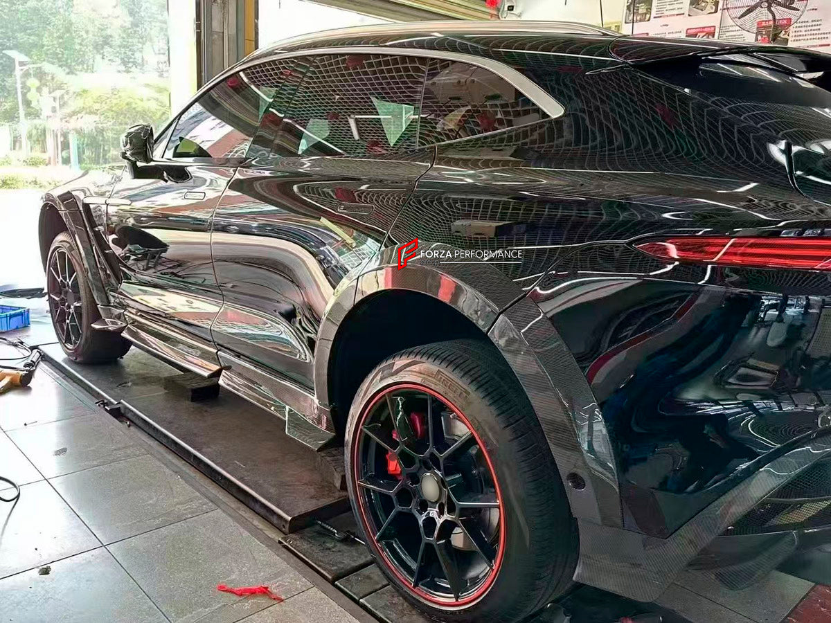 DRY CARBON BODY KIT for Aston Martin DBX AM8 2020 - 2024
Set includes:

Front Lip
Front Canards
Hood Air Vents
Side Mirrors
Side Fenders
Side Air Vents
Side Skirts
Rear Bumper
Rear Spoiler Wing
Exhaust System
Exhaust Tips
Material: Dry Carbon

NOTE: Professional installation is required.