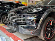 DRY CARBON BODY KIT for Aston Martin DBX AM8 2020 - 2024
Set includes:

Front Lip
Front Canards
Hood Air Vents
Side Mirrors
Side Fenders
Side Air Vents
Side Skirts
Rear Bumper
Rear Spoiler Wing
Exhaust System
Exhaust Tips
Material: Dry Carbon

NOTE: Professional installation is required.