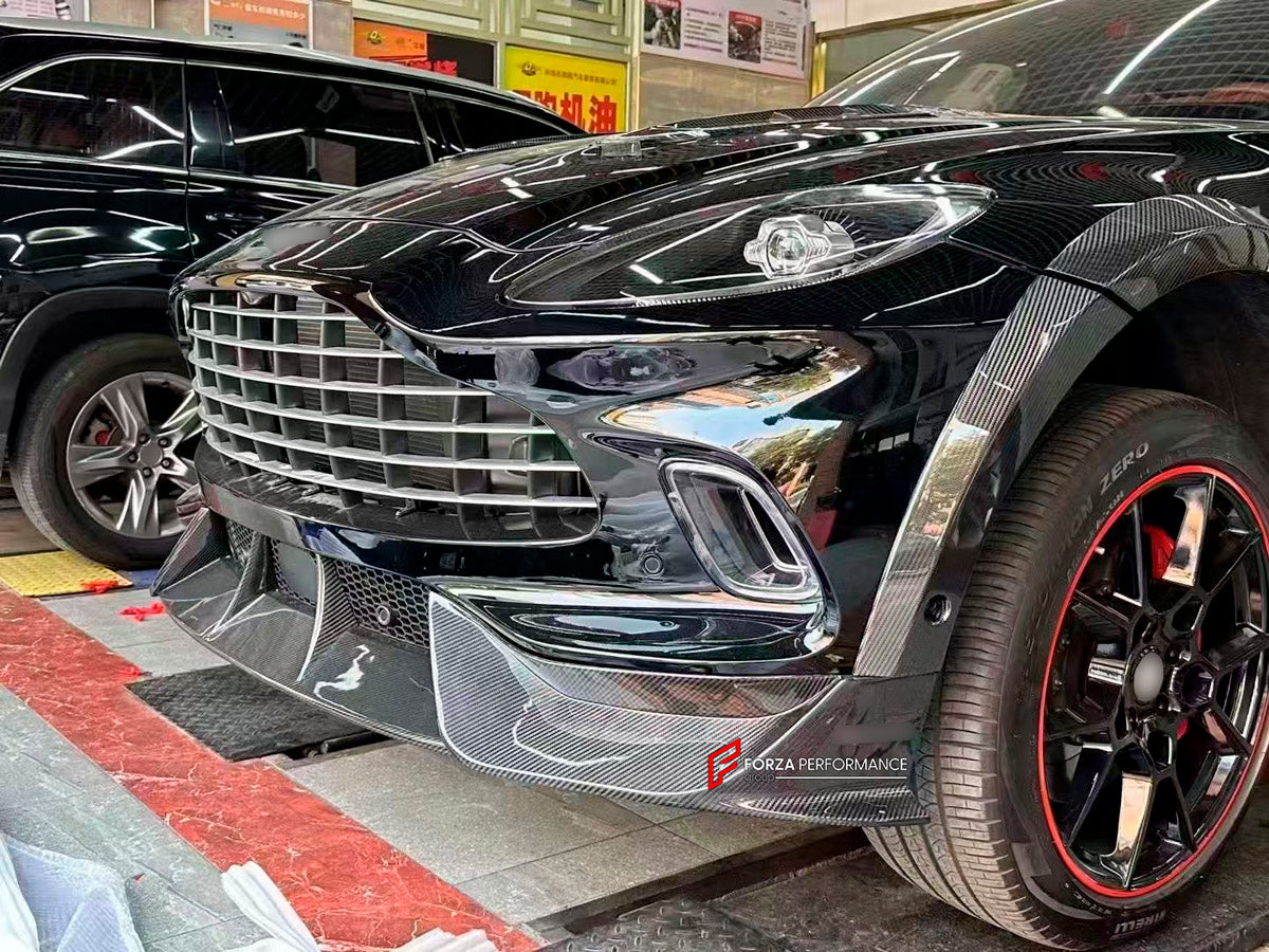 DRY CARBON BODY KIT for Aston Martin DBX AM8 2020 - 2024
Set includes:

Front Lip
Front Canards
Hood Air Vents
Side Mirrors
Side Fenders
Side Air Vents
Side Skirts
Rear Bumper
Rear Spoiler Wing
Exhaust System
Exhaust Tips
Material: Dry Carbon

NOTE: Professional installation is required.