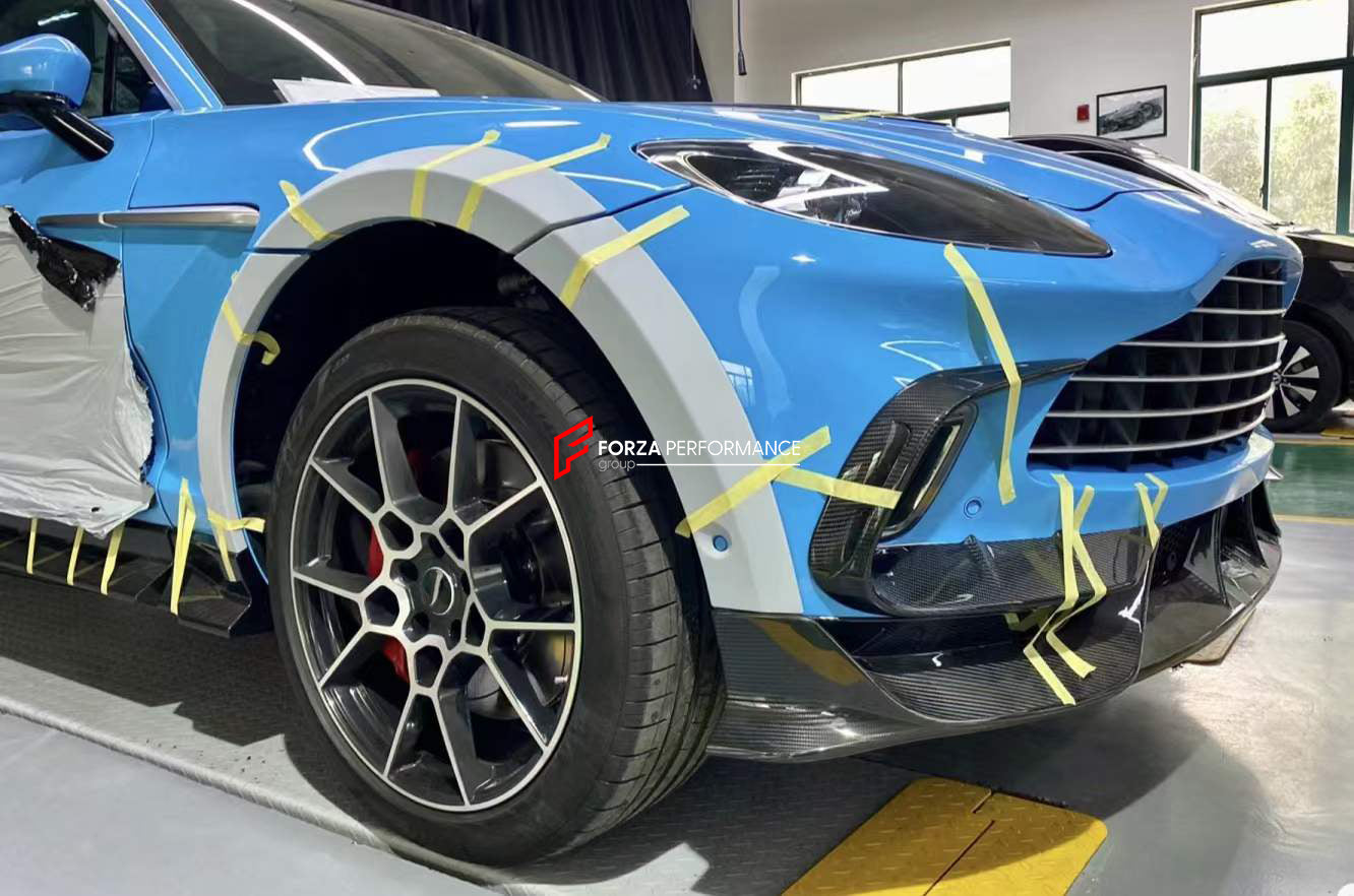 DRY CARBON BODY KIT for ASTON MARTIN DBX  Set includes:  Front Lip Side Fenders Hood Air Vents Side Air Vents Front Canards Side Skirts Rear Bumper Exhaust System Exhaust Tips