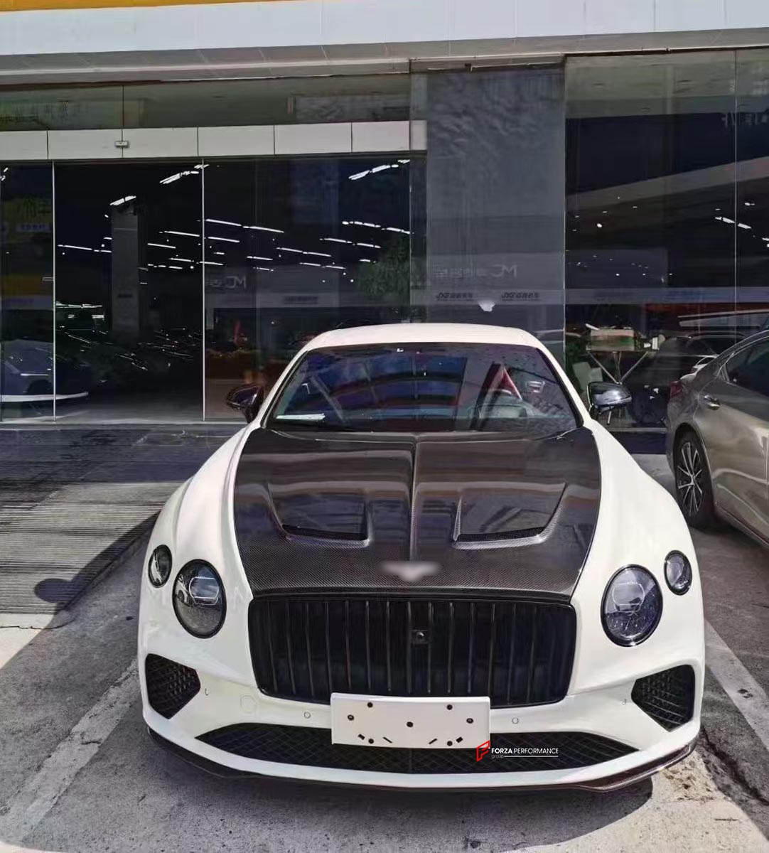 DRY CARBON BODY KIT for BENTLEY CONTINENTAL GT/GTC V8 W12 2018+
Set includes:

Front Lip
Front Grille
Front Bumper Trims
Mirror Caps
Hood Bonnet
Side Skirts
Rear Diffuser
Rear Spoiler (optional, at extra cost)
Material: Dry Carbon

NOTE: Professional installation is required.