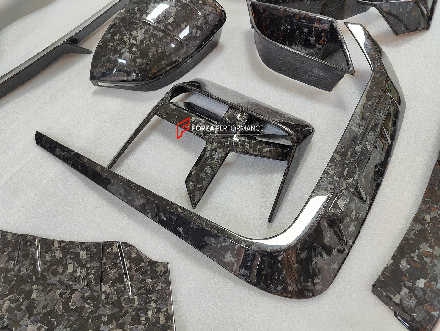 DRY CARBON BODY KIT for BMW 7 SERIES G70 2022+

Set includes:

Front Lip
Front Bumper Trims
Front Bumper Air Vent Covers
Side Mirror Covers
Side Trims
Side Skirts
Roof Spoiler
Rear Spoiler
Rear Diffuser

Material: Dry Carbon

Note: Professional installation is required. If you have 760i you don't need to change the bumpers