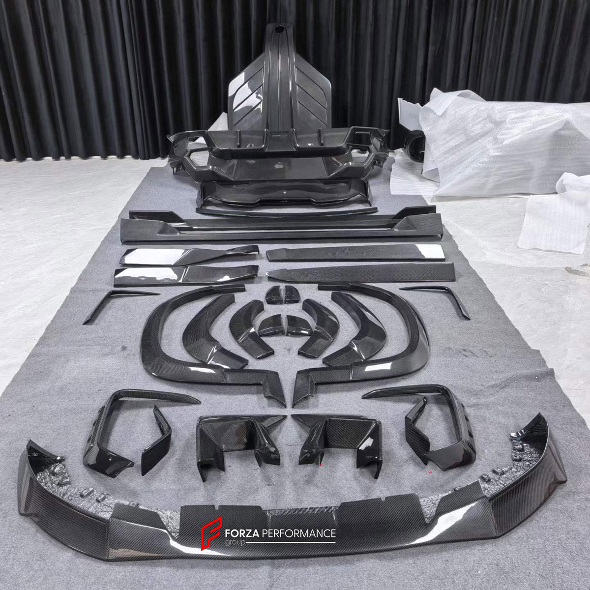 DRY CARBON BODY KIT for BMW XM G09 2023+ FORZA PERFORMANCE custom fit MS Style

Set includes:
Front Lip
Front Bumper Canards
Hood Bonnet
Fender Flares
Side Skirts
Roof Spoiler
Ducktail Spoiler
Rear Bumper
Rear Diffuser

Material: Dry Carbon

NOTE: Professional installation is required.