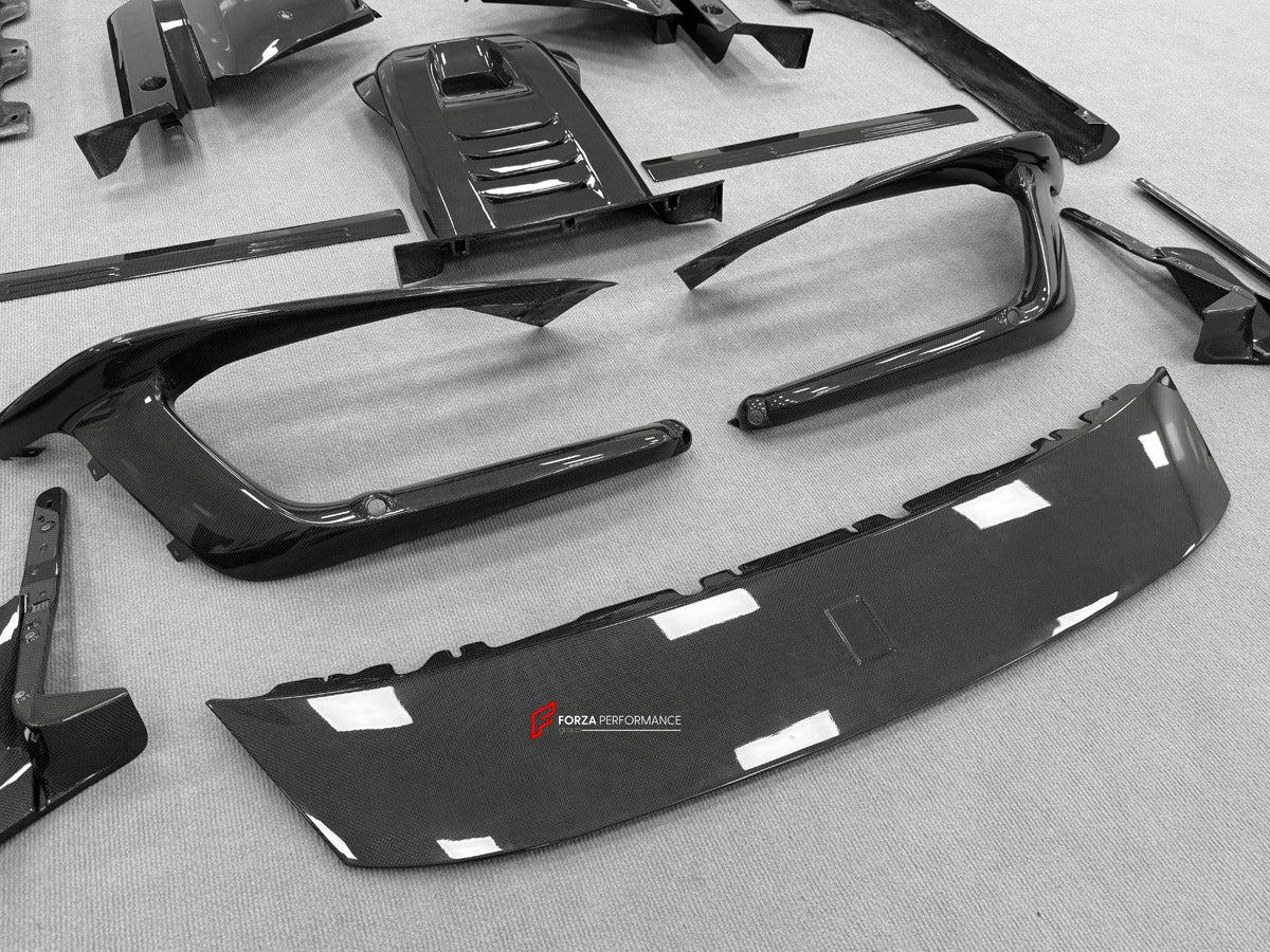 DRY CARBON BODY KIT for Ferrari 12Cilindri 2024+
Set includes:

Front Lip
Front Bumper Fins
Engine Cover Lid
Door Sill Covers
Side Skirts
Ducktail Spoiler
Rear Diffuser
Material: Dry Carbon

NOTE: Professional installation is required.