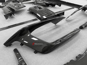 DRY CARBON BODY KIT for Ferrari 12Cilindri 2024+
Set includes:

Front Lip
Front Bumper Fins
Engine Cover Lid
Door Sill Covers
Side Skirts
Ducktail Spoiler
Rear Diffuser
Material: Dry Carbon

NOTE: Professional installation is required.