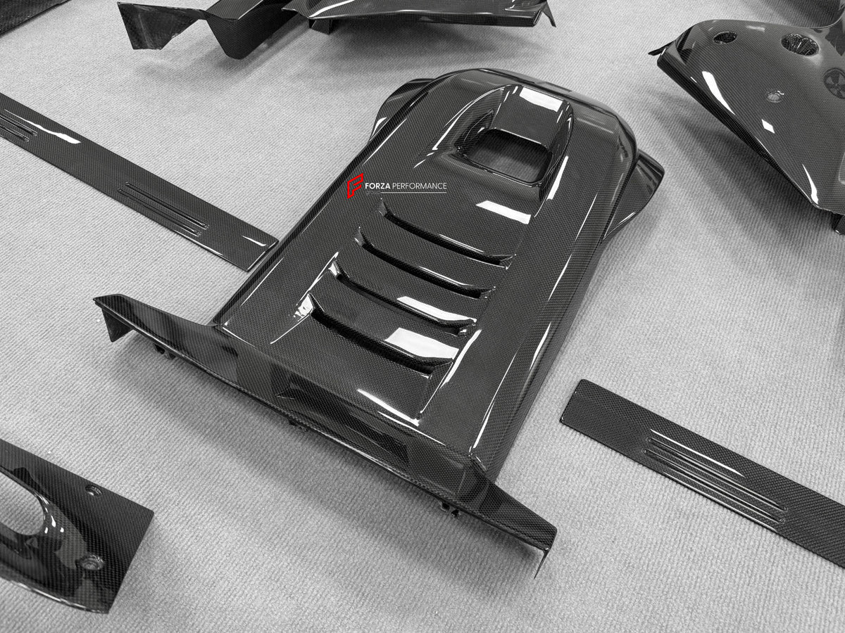 DRY CARBON BODY KIT for Ferrari 12Cilindri 2024+
Set includes:

Front Lip
Front Bumper Fins
Engine Cover Lid
Door Sill Covers
Side Skirts
Ducktail Spoiler
Rear Diffuser
Material: Dry Carbon

NOTE: Professional installation is required.