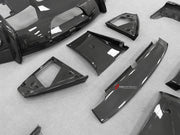DRY CARBON BODY KIT for Ferrari 12Cilindri 2024+
Set includes:

Front Lip
Front Bumper Fins
Engine Cover Lid
Door Sill Covers
Side Skirts
Ducktail Spoiler
Rear Diffuser
Material: Dry Carbon

NOTE: Professional installation is required.
