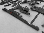 DRY CARBON BODY KIT for Ferrari 12Cilindri 2024+
Set includes:

Front Lip
Front Bumper Fins
Engine Cover Lid
Door Sill Covers
Side Skirts
Ducktail Spoiler
Rear Diffuser
Material: Dry Carbon

NOTE: Professional installation is required.