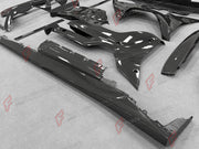 DRY CARBON BODY KIT for Ferrari 12Cilindri 2024+
Set includes:

Front Lip
Front Bumper Fins
Engine Cover Lid
Door Sill Covers
Side Skirts
Ducktail Spoiler
Rear Diffuser
Material: Dry Carbon

NOTE: Professional installation is required.