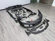 DRY CARBON BODY KIT for FERRARI 296 GTB GTS 2022+ FORZA PERFORMANCE custom fit Mansory Style

Set includes:
Front Lip
Front Bumper Assembly
Front Fenders
Side Fender Vents
Side Skirts
Rear Spoiler Wing
Rear Diffuser

Material: Dry Carbon

NOTE: Professional installation is required.