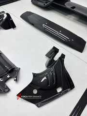DRY CARBON BODY KIT for FERRARI 296 GTB GTS 2022+ FORZA PERFORMANCE custom fit OEM Style

Set includes:
Front Lip Splitter
Door Sills
Side Skirts
Rear Spoiler Wing
Engine Bay Trim Covers
Rear Diffuser

Material: Dry Carbon

NOTE: Professional installation is required.