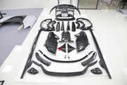 DRY CARBON BODY KIT for Ferrari Purosangue 2023+
Set includes:

Front Lip
Front Bumper
Hood Bonnet
Engine Cover
Front Fender Flares
Side Mirror Covers
Side Skirts
Rear Fender Flares
Roof Spoiler
Ducktail Spoiler
Rear Diffuser
Material
Dry Carbon
Note
Professional installation is required.