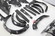 DRY CARBON BODY KIT for Ferrari Purosangue 2023+
Set includes:

Front Lip
Front Bumper
Hood Bonnet
Engine Cover
Front Fender Flares
Side Mirror Covers
Side Skirts
Rear Fender Flares
Roof Spoiler
Ducktail Spoiler
Rear Diffuser
Material
Dry Carbon
Note
Professional installation is required.