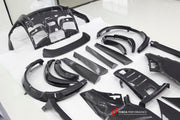 DRY CARBON BODY KIT for Ferrari Purosangue 2023+
Set includes:

Front Lip
Front Bumper
Hood Bonnet
Engine Cover
Front Fender Flares
Side Mirror Covers
Side Skirts
Rear Fender Flares
Roof Spoiler
Ducktail Spoiler
Rear Diffuser
Material
Dry Carbon
Note
Professional installation is required.